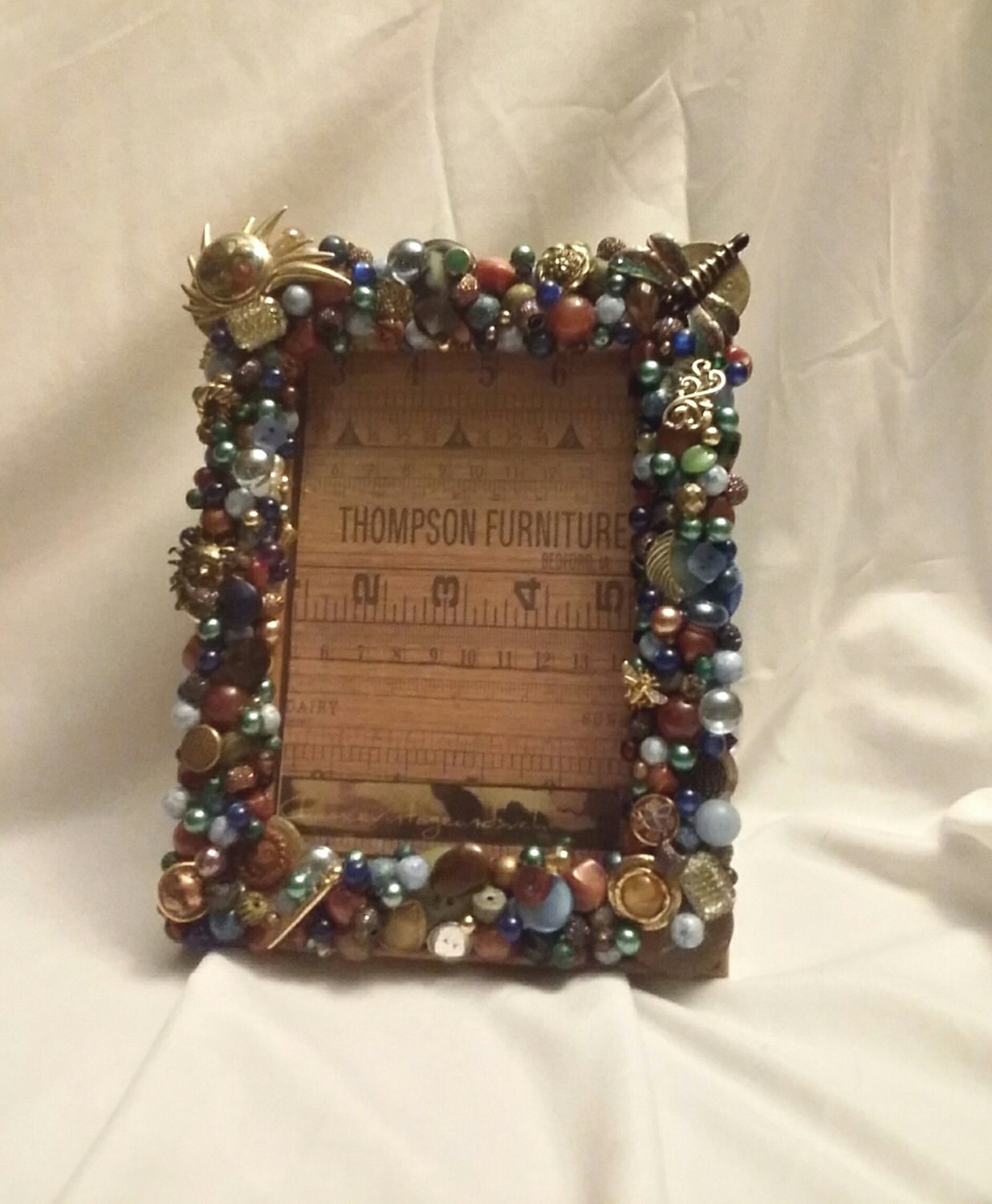 Vintage jewelry jeweled picture frame in blues and warm tones