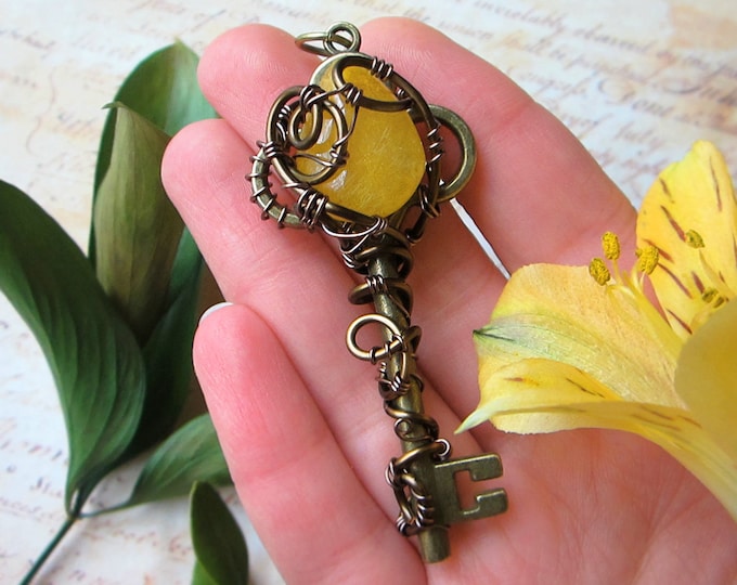 Medium size necklace "DreamLand" with yellow Rutilated Quartz wire wrapped to a vintage skeleton key. Custom length chain.