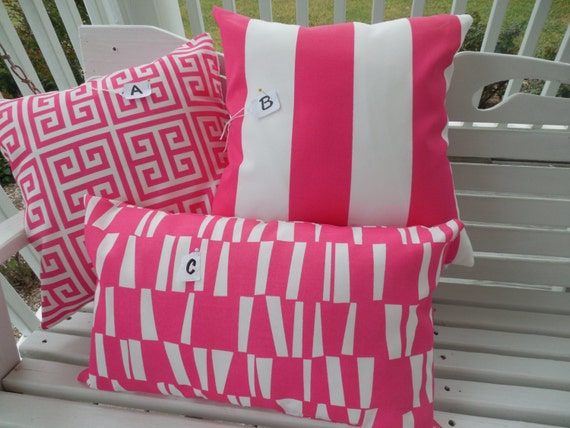 pink and white striped outdoor pillows