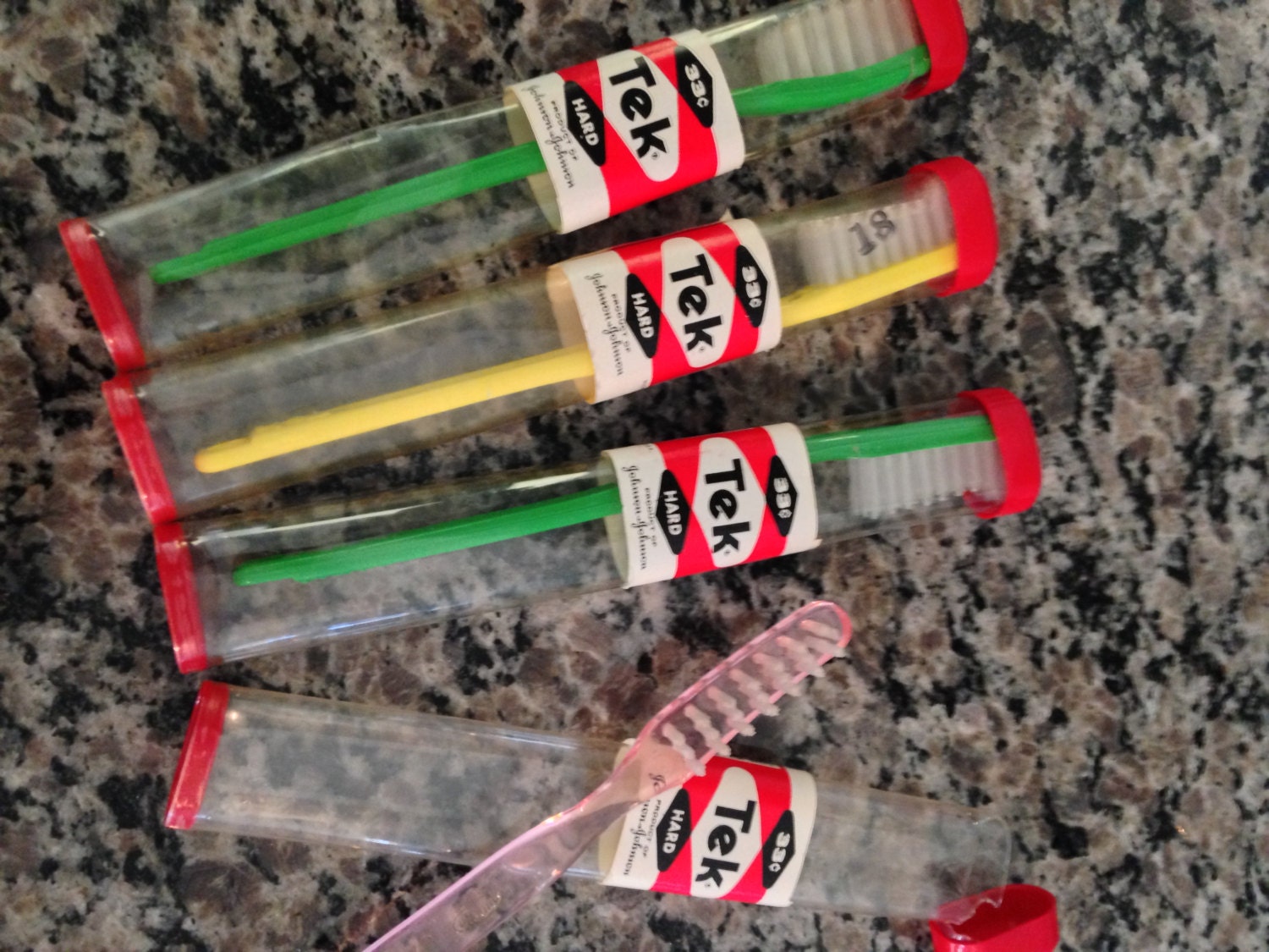 Hard Bristle Tek Toothbrushes by Johnson and Johnson