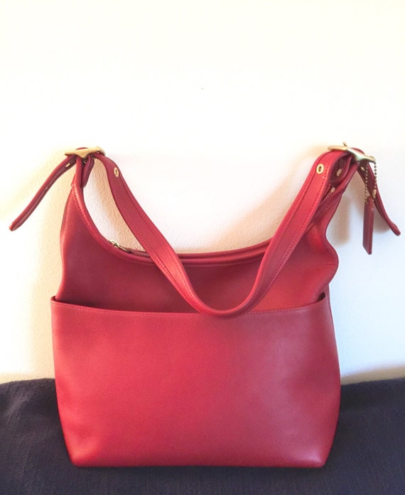 coach bag with red straps