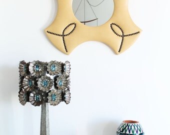 Vintage mirror, cream color leatherette and brass tacks. Mid century 60s.