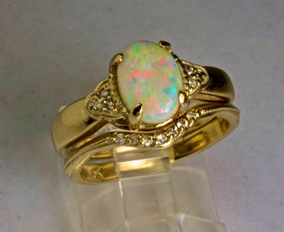 Antique style Opal Engagement ring with Diamond accents.