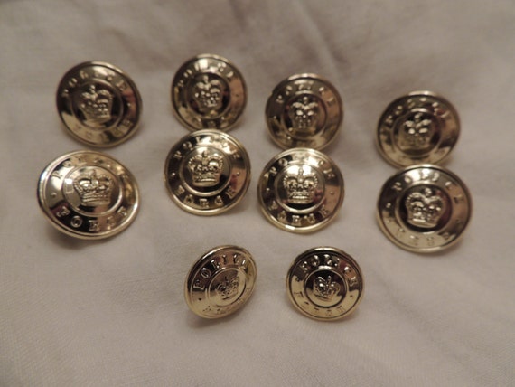 Vintage Golden Canadian police force buttons with royal crown in the ...