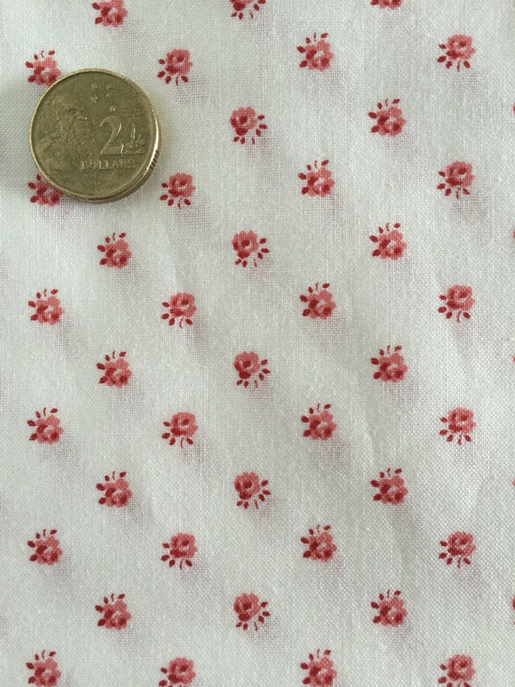 White fabric with tiny red flowers