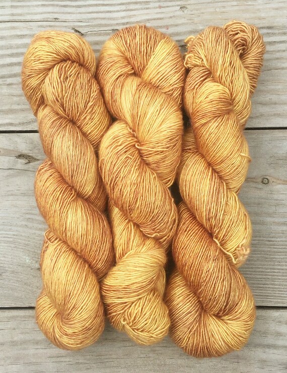 Straw into Gold Hand Dyed Superwash Merino by BlackCatFibersLLC