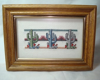 1980s SAGUARO Cactus in Desert with Mountains Framed Cross Stitch.