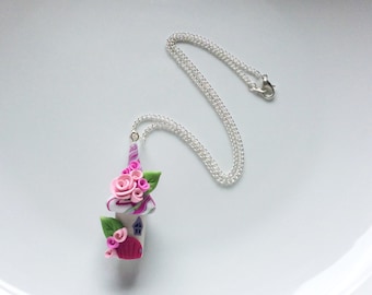Fairy house necklace in pink colours handmade from polymer clay