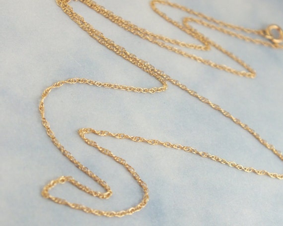 https://www.etsy.com/listing/473977129/18-solid-gold-rope-chain-89mm-delicate?ga_order=most_relevant&ga_search_type=all&ga_view_type=gallery&ga_search_query=solid%20gold%20delicate%20necklace%20rope&ref=sr_gallery_1