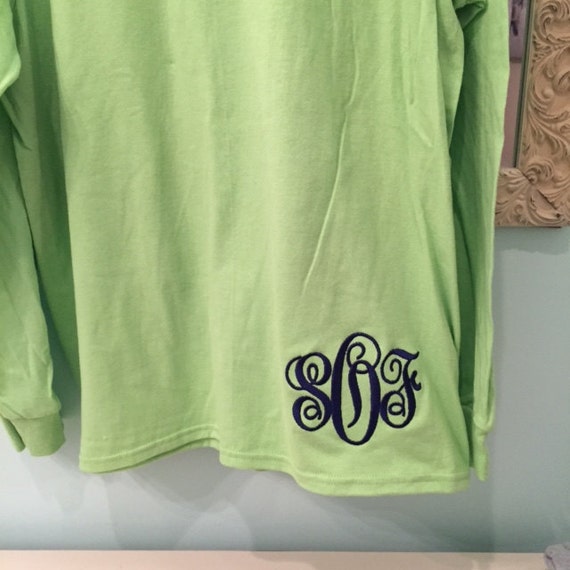 monogram on bottom of shirt