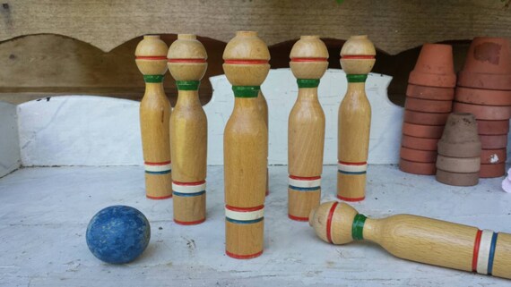 antique skittles game with wooden pins and iron bumbers antique skittles game with wooden pins and iron bumbers