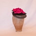 Stunning gunmetal coloured occasion hat with fuchsia pink rose decoration