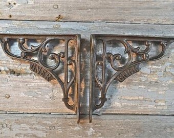A pair of GNER railway cast iron shelf brackets
