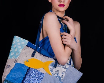 Blue leather bag with fish