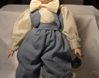Brinns's musical porcelain doll-plays Raindrops keep falling on my head-1987