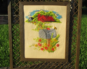 vintage 80s crewel featuring a red barn, mailbox on post, and wild flowers, framed crewel, retro crewel, crewel art, floral crewel, country