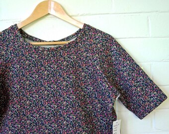 Liberty of London Fleece Short Sleeve Cropped Sweatshirt in Black/Hot Pink Floral.