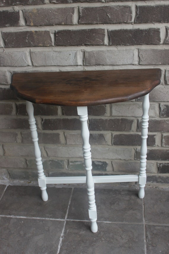 Lovingly restored half moon table. Perfect all around decor.