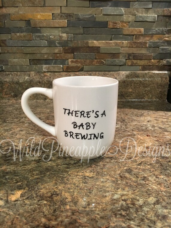 Theres a baby brewing coffee mug