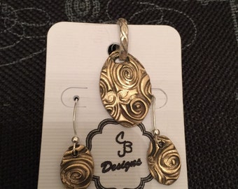 Antique bronze earring and penant set.completely hand madeand designed