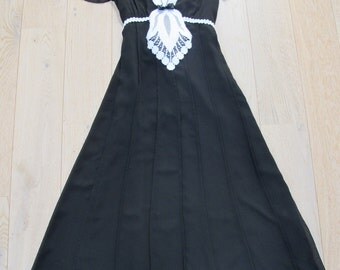 Romantic black and white dress with lace .