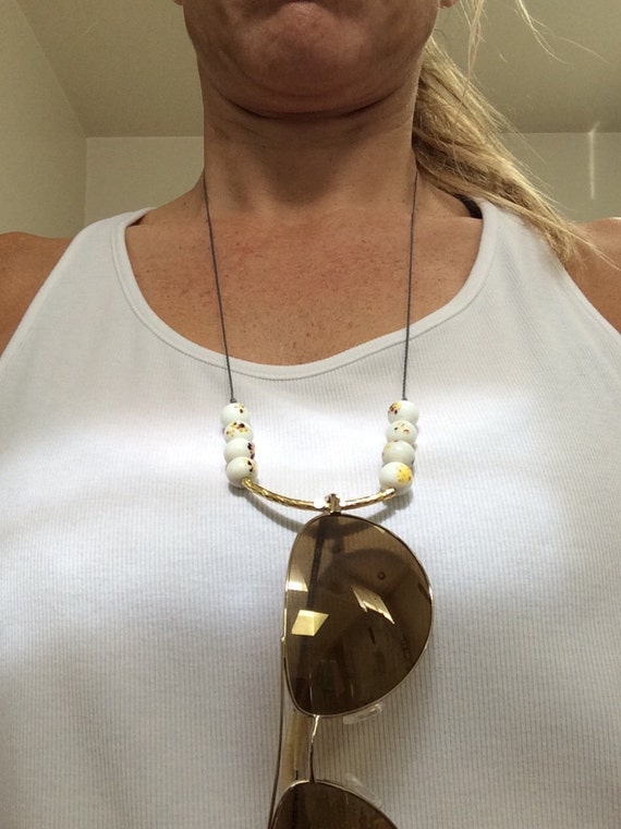 Items similar to Eyeglass holder/necklace on Etsy