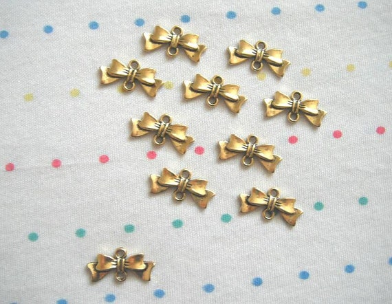 Antique gold bow connector charms finish