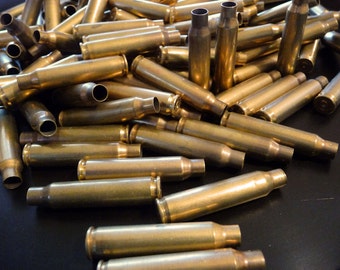 BULLETS - 12 brass shells, bullet casings, spent shells, large shells