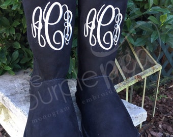 monogram plaque long leather boots