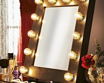 Illuminated free standing mirror