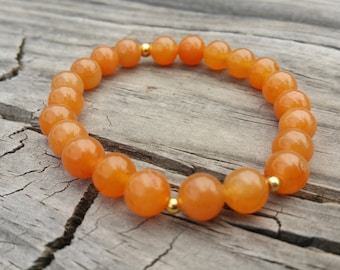 Red aventurine gemstone stretch bracelet with gold plated beads