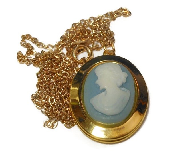 SALE Sarah Coventry cameo locket, pendant cameo double locket, white silhouette on light blue background, gold tone chain and casing.