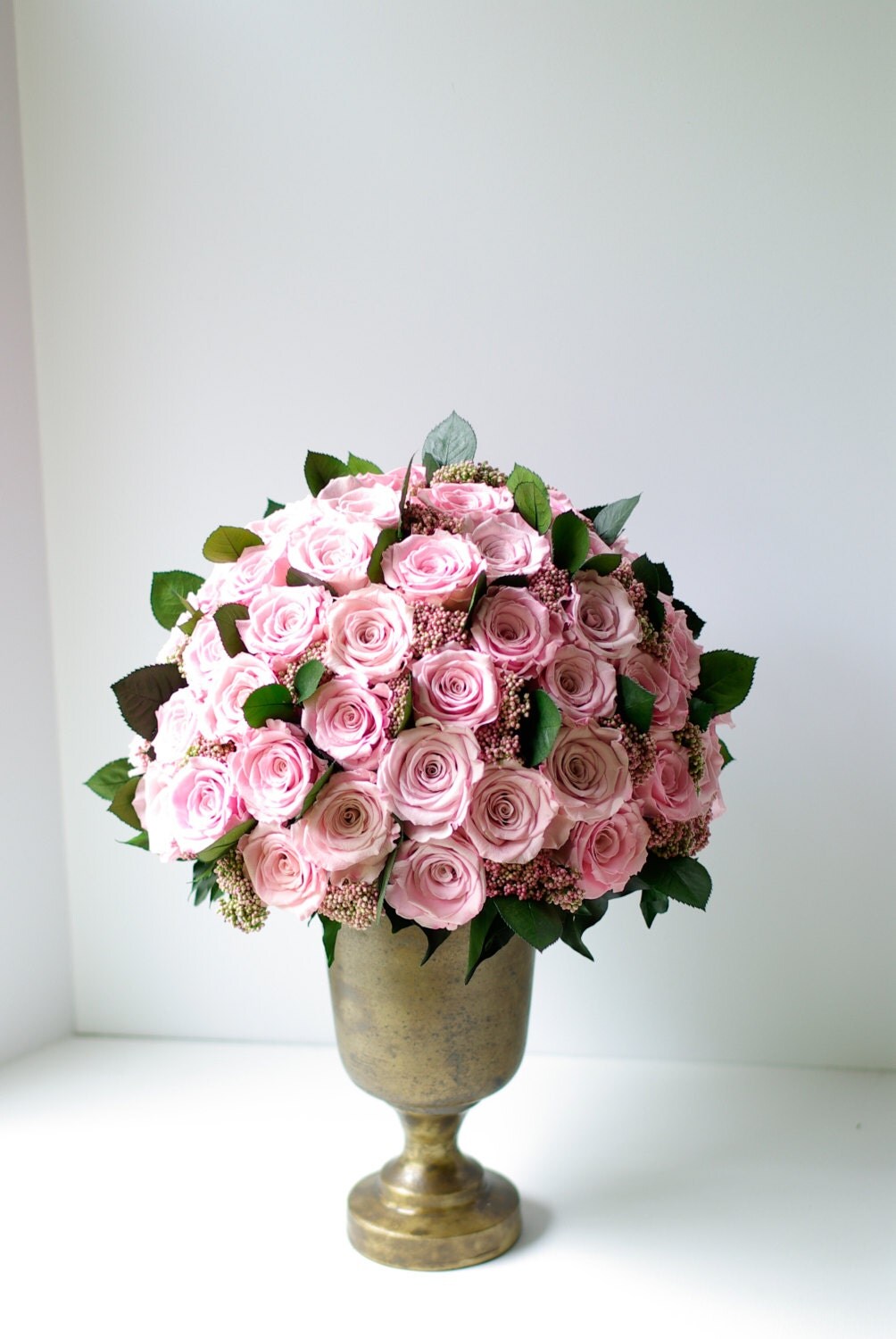 Forever preserved roses. Pale pink rose urn Hotel lobby