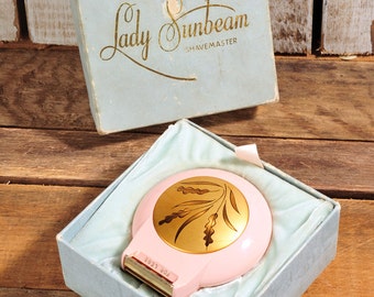 Vintage 1950s Lady Sunbeam Shavemaster Electric Shaver for Women. Model LS Pink. Includes box and instructions. Still works very Cool!