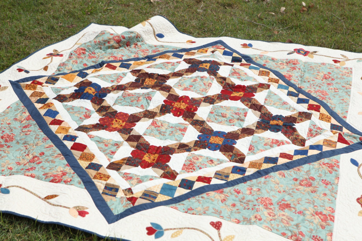Country style quilt. Red white blue and brown