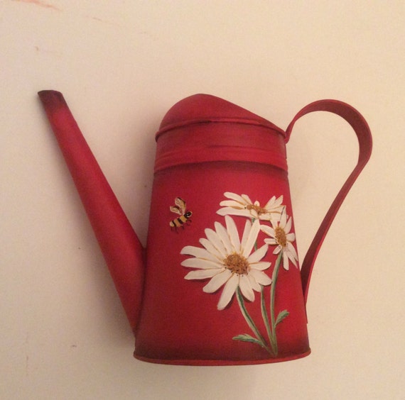 Hand painted watering can with daiseys on a red by PaintedbyYvette