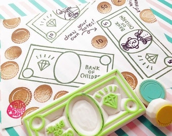play money stamp set. toy money hand carved rubber stamps. bank note stamp. coin stamp. craft stamps. birthday props. set of 3