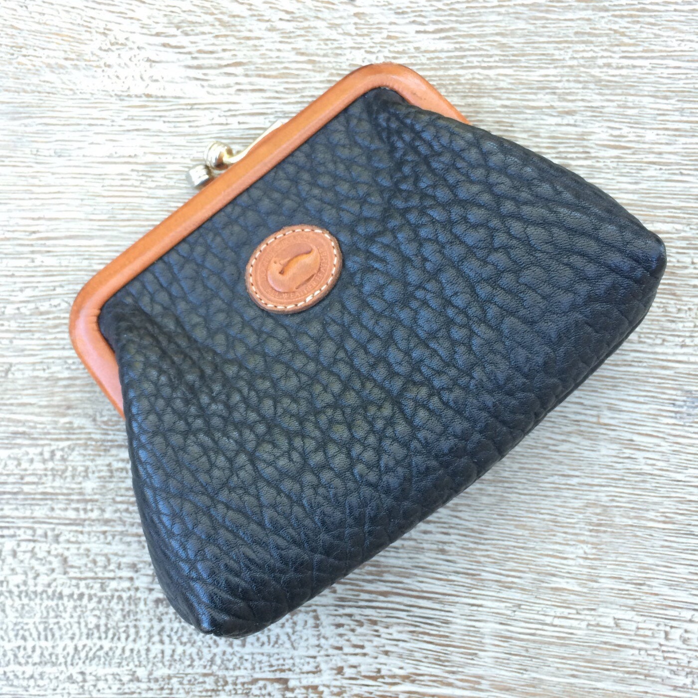 dooney and bourke round purse