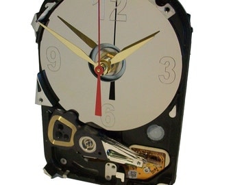 Hard Drive Clock has Unusual Shape with Acrylic Stand and Etched Disk Platter as the Dial.