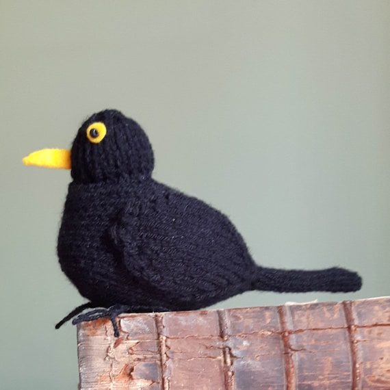 Knitted blackbird with poseable wire feet by knitforvictory