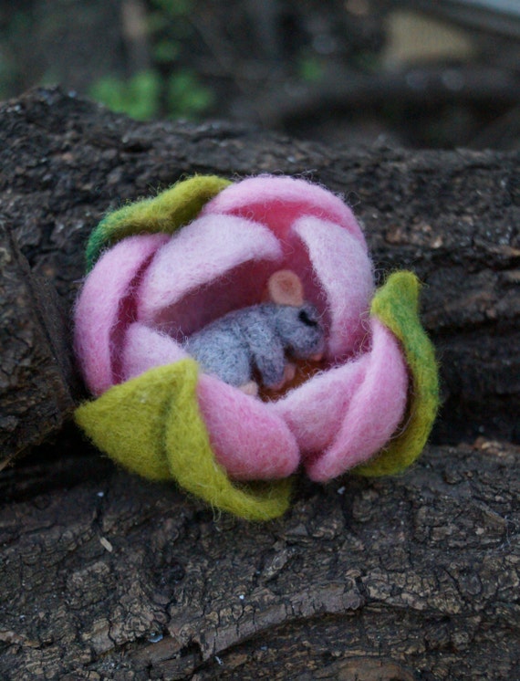 little mouse sleeping in a pink flower