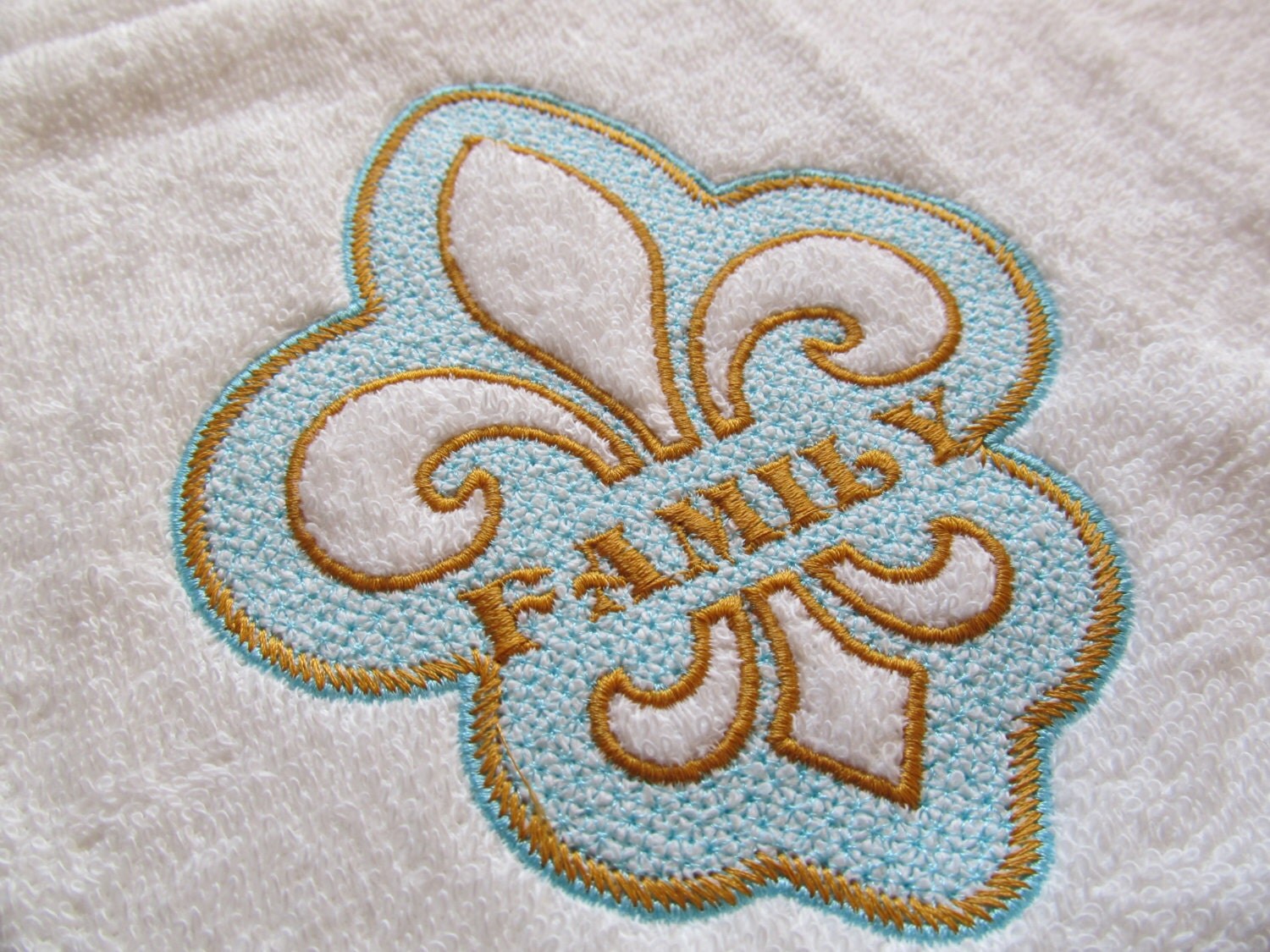 Embossed Towel Fleur de Lis embroidery split applique design