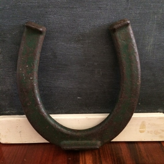 Vintage green horseshoe from horseshoe game