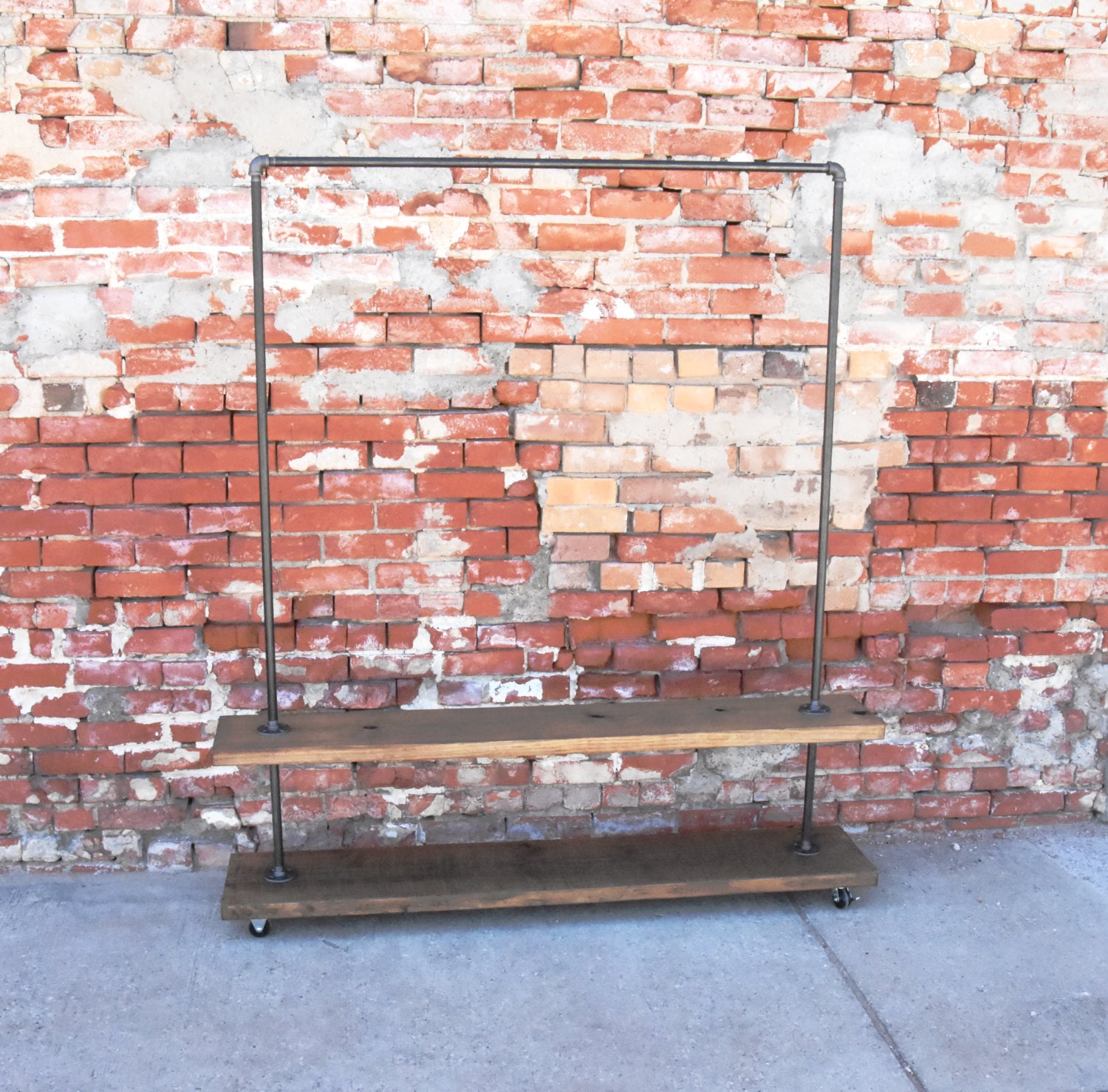 Urban Industrial plumbing pipe garment rack with bottom shelf.