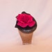 Stunning gunmetal coloured occasion hat with fuchsia pink rose decoration