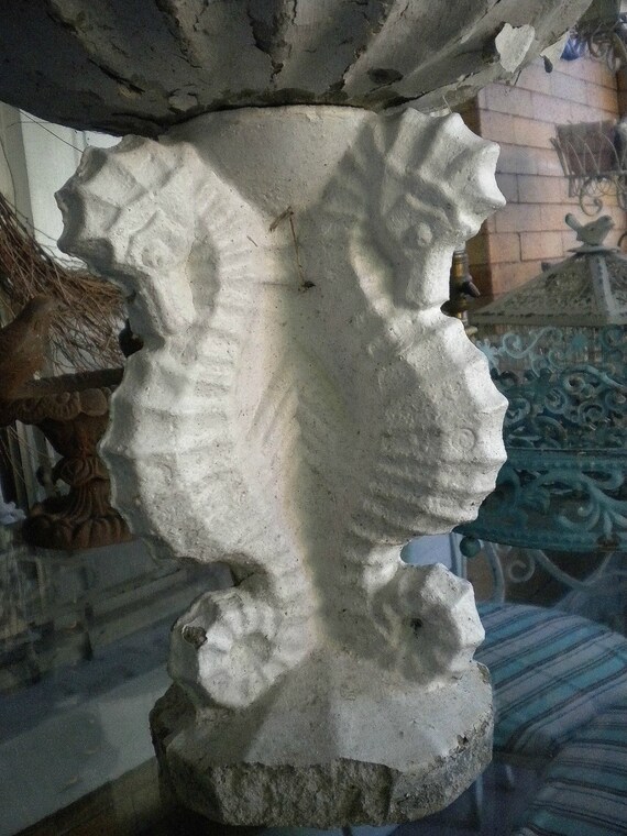 concrete seahorse statue