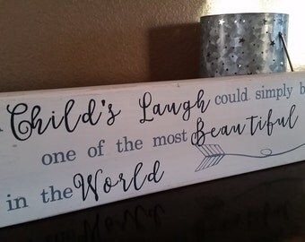 A Child's Laugh Hand-painted, Distressed Wooden Sign