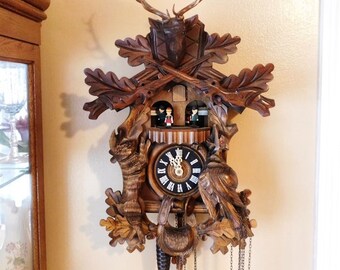 Black Forest Cuckoo Clock Vintage Deer Hunter Hunting Rifles Ammunition Bag Horn Animals Rabbit Pheasant Musical Carousel Dancers Thorens