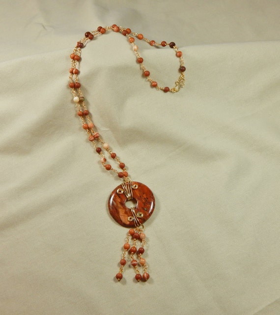 Rust Colored Beaded Necklace with Wire Wrapped Donut Focal
