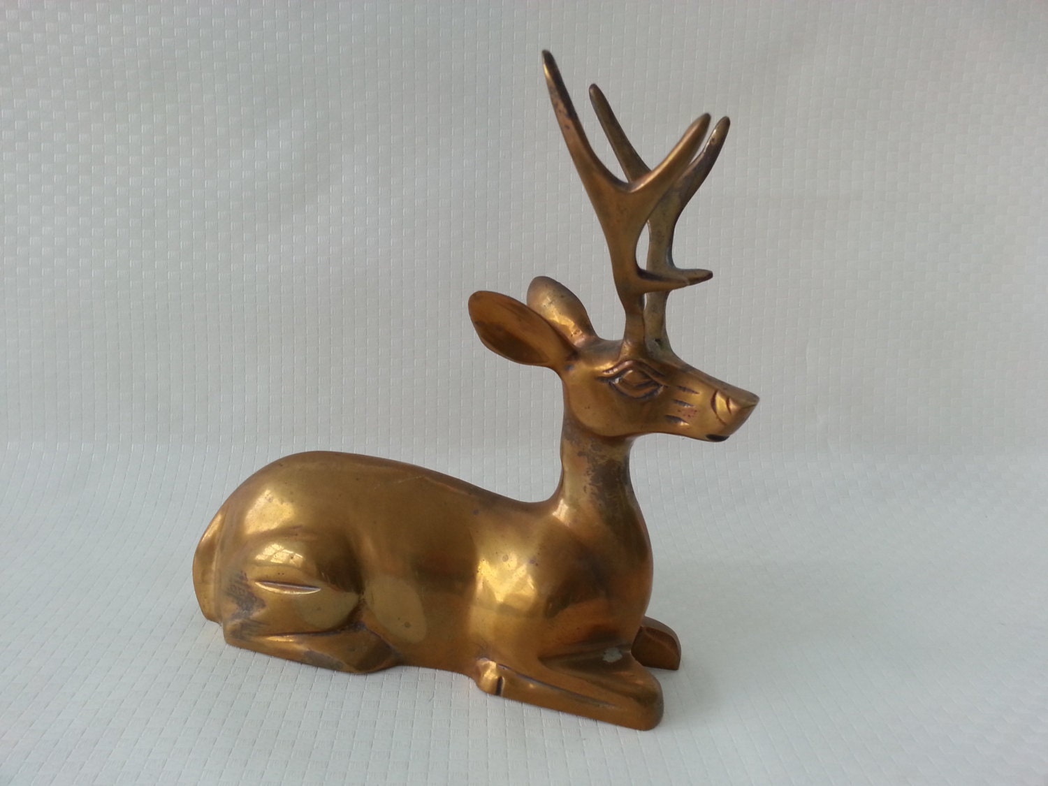 laying deer figurine